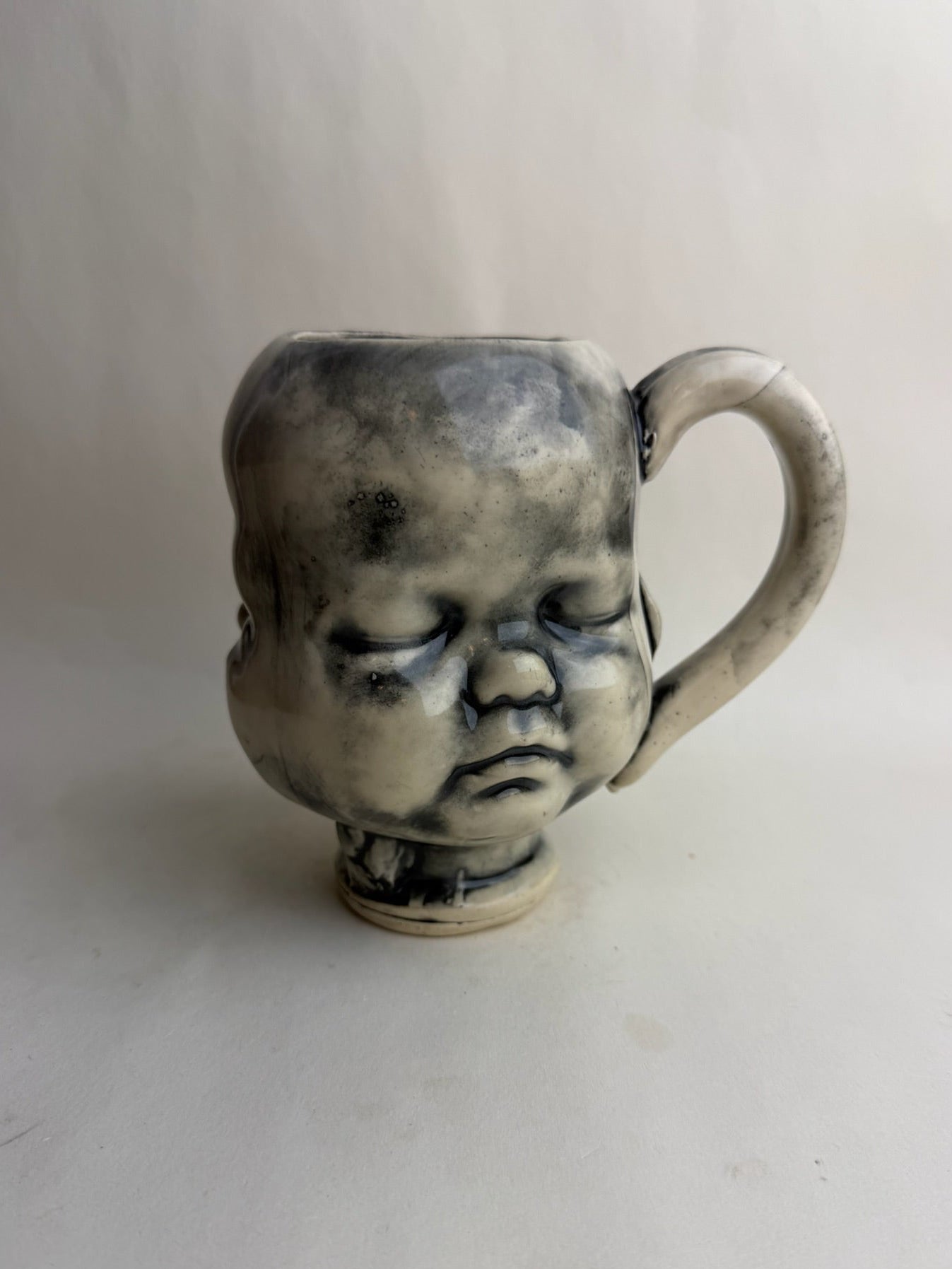 Three Face Baby Doll Head Mug