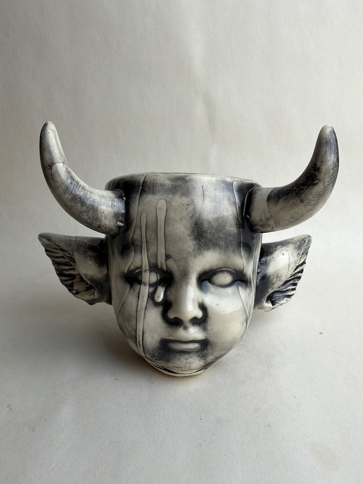 Horned Baby Doll Head With Ears