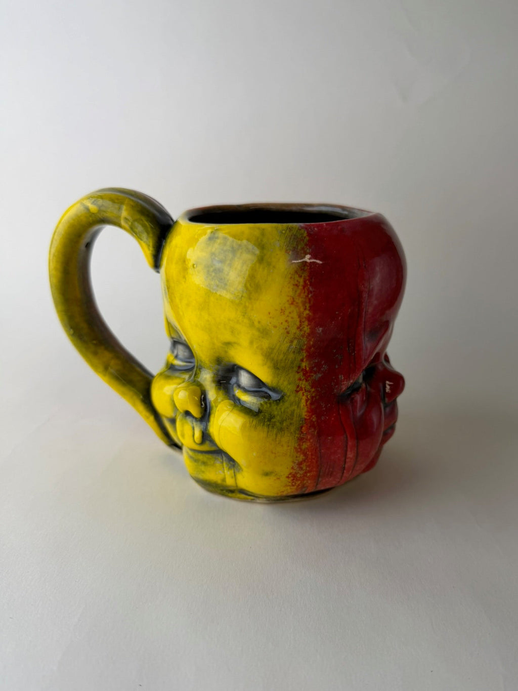 Three Face Baby Doll Head Mug, Warm Colors