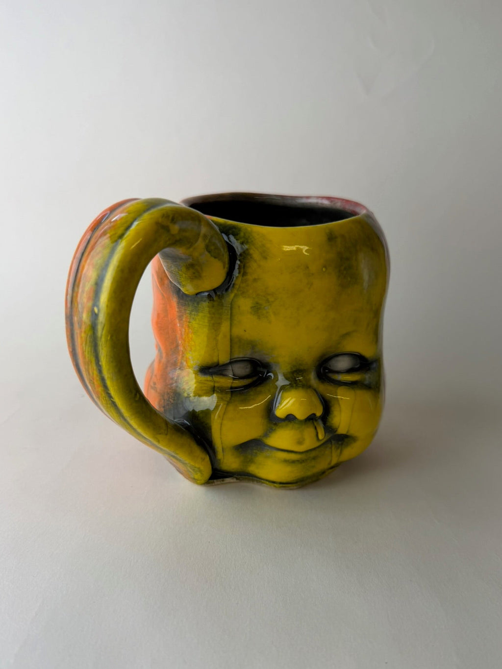 Three Face Baby Doll Head Mug, Warm Colors