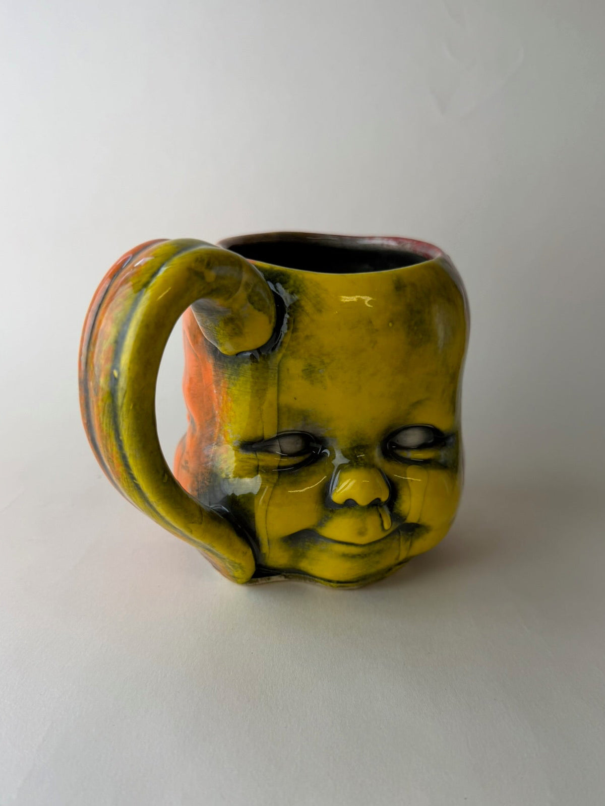 Three Face Baby Doll Head Mug, Warm Colors