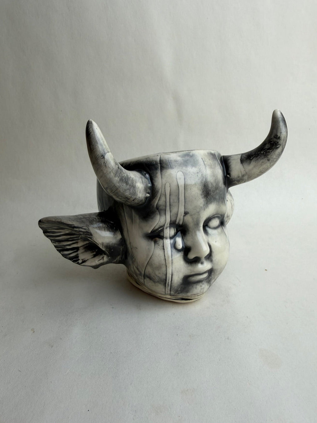 Horned Baby Doll Head With Ears