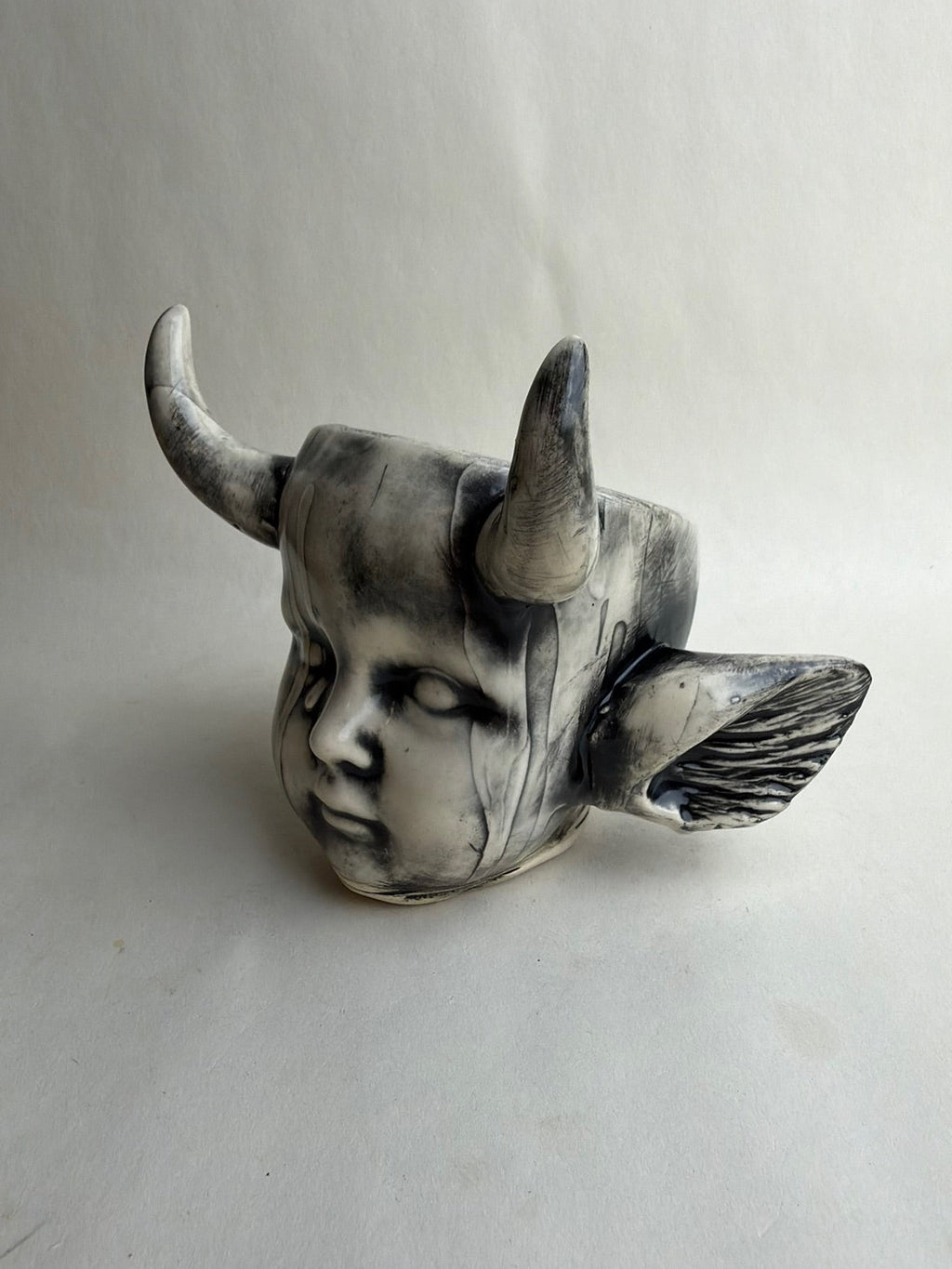 Horned Baby Doll Head With Ears