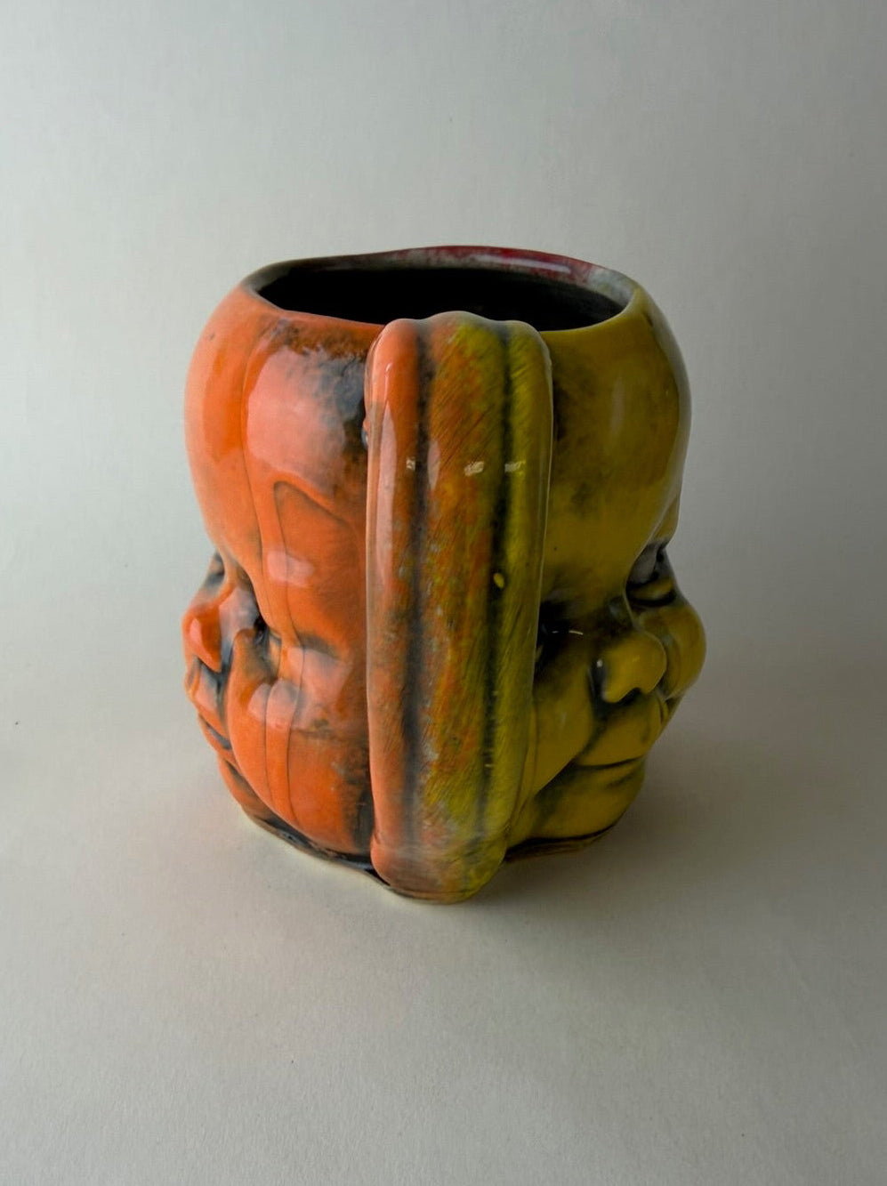 Three Face Baby Doll Head Mug, Warm Colors