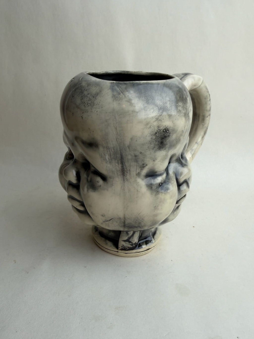 Three Face Baby Doll Head Mug