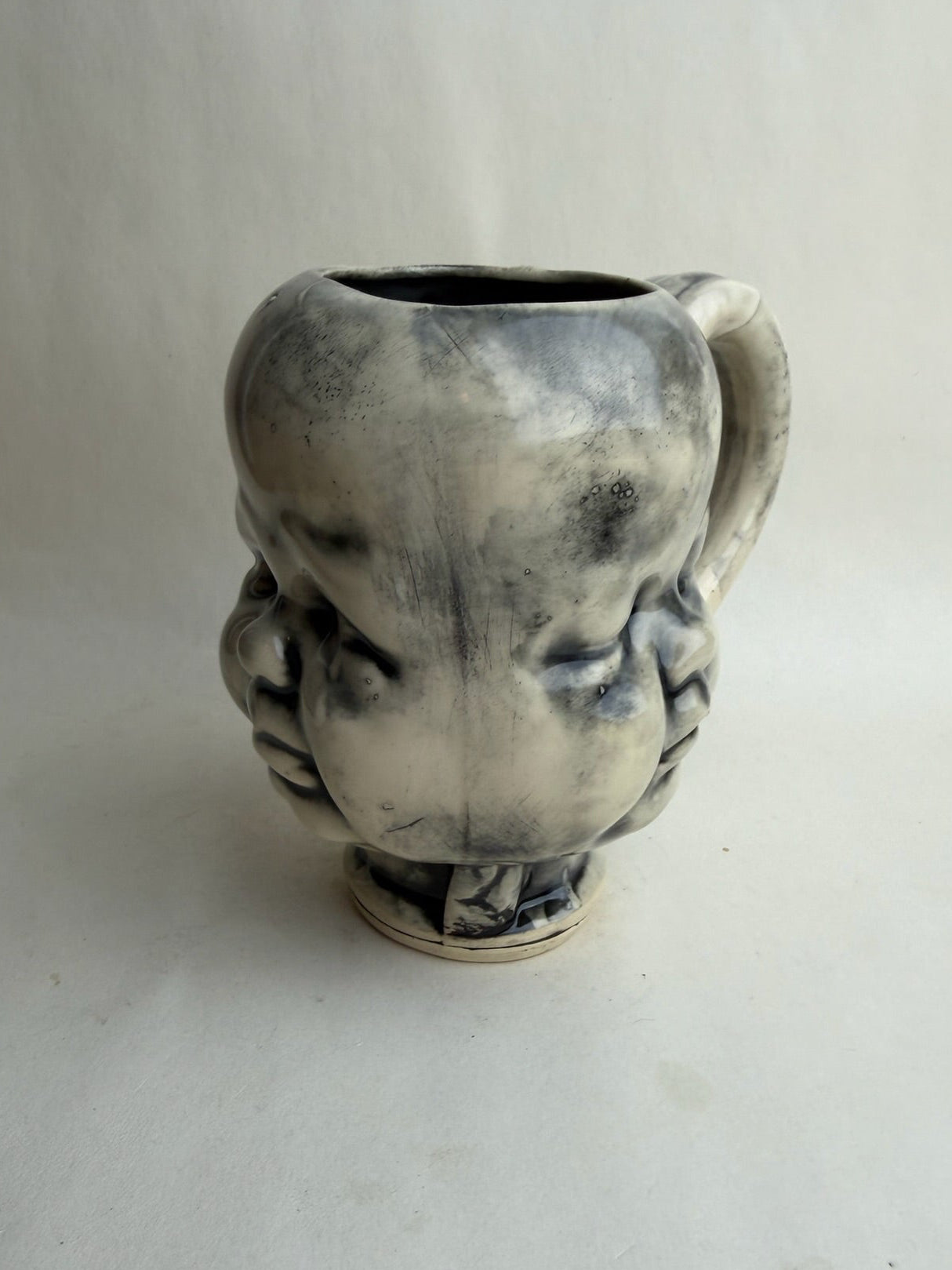 Three Face Baby Doll Head Mug