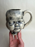 Three Face Baby Doll Head Mug