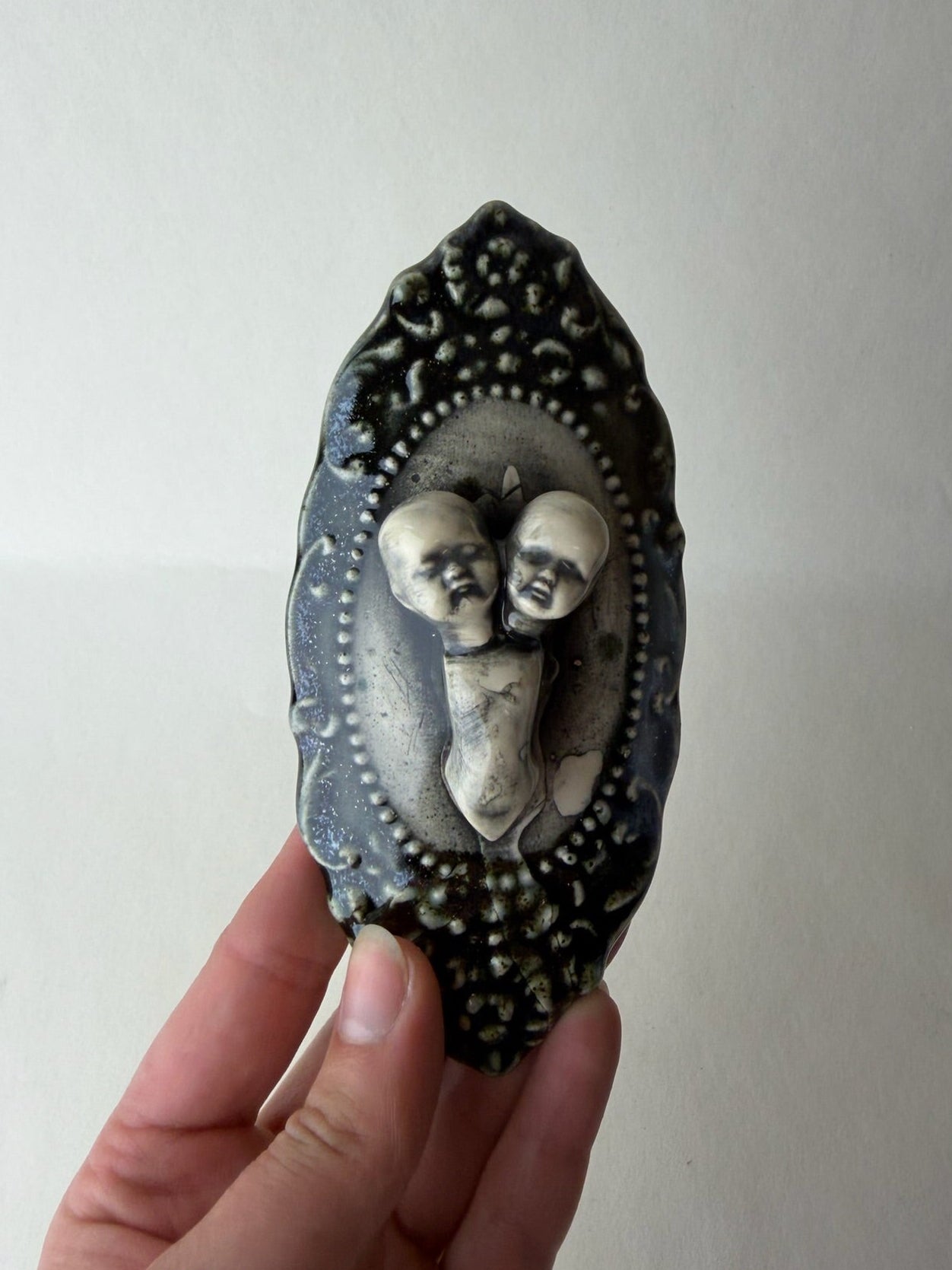 Two Headed Baby Doll Wall Decoration