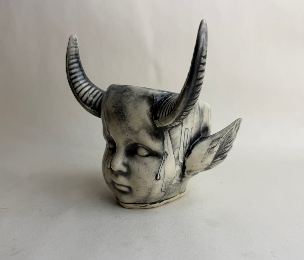 Horned Baby Doll Head With Pointed Ears