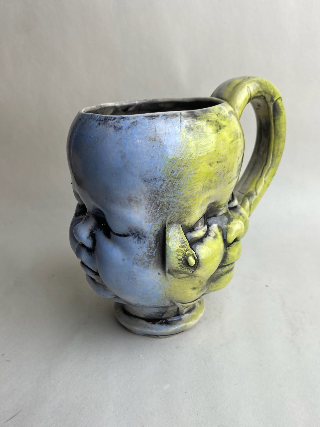 Three Face Baby Doll Head Mug