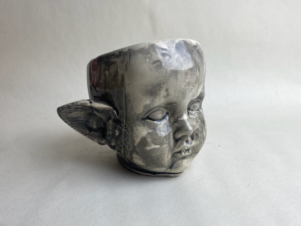 Monster Baby Doll Head With Pointed Ears and Fangs