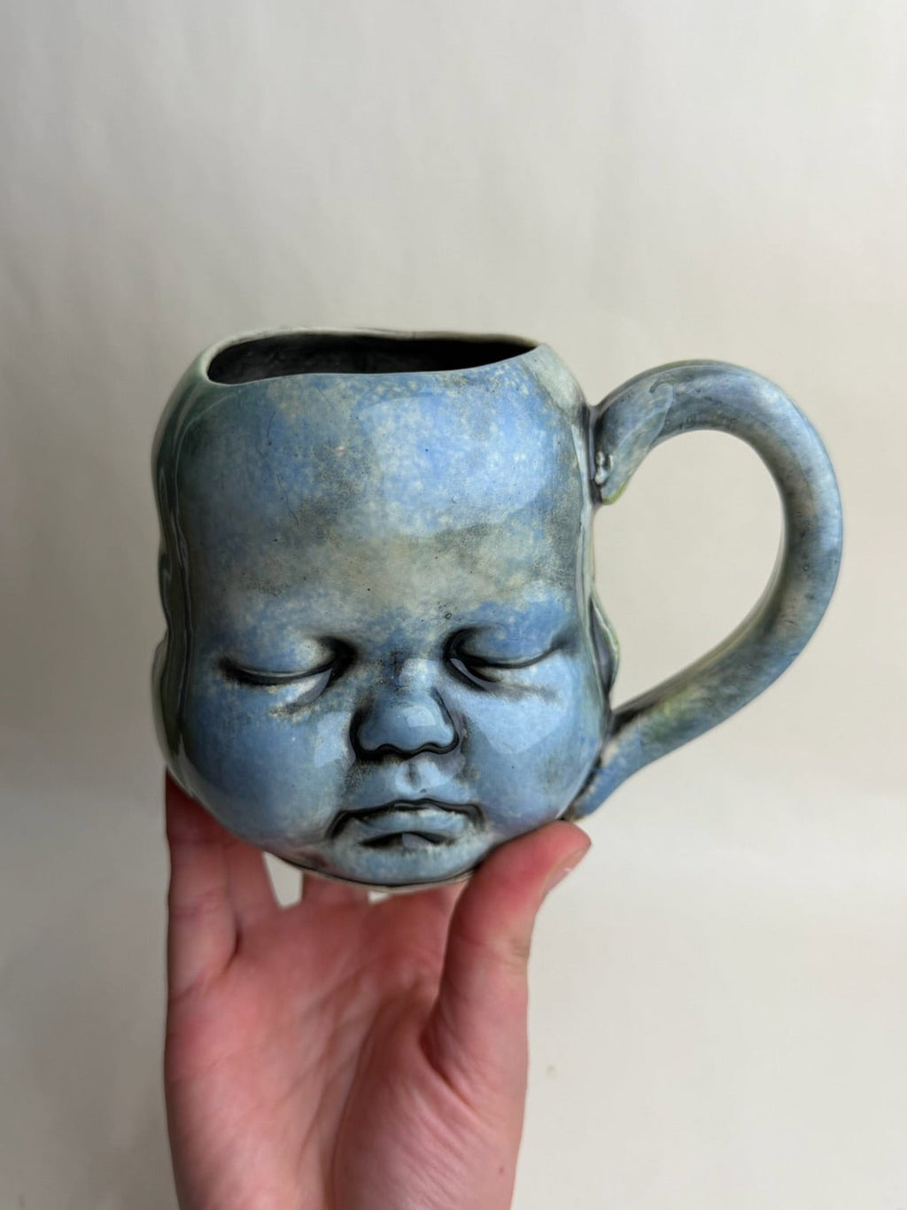 Three Face Baby Doll Head Mug
