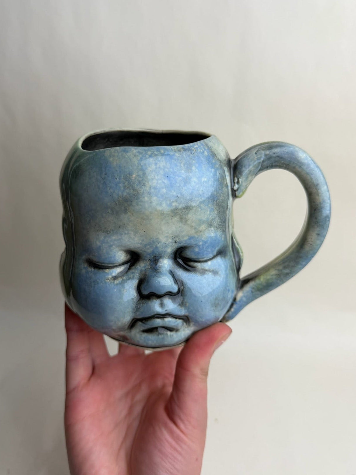 Three Face Baby Doll Head Mug
