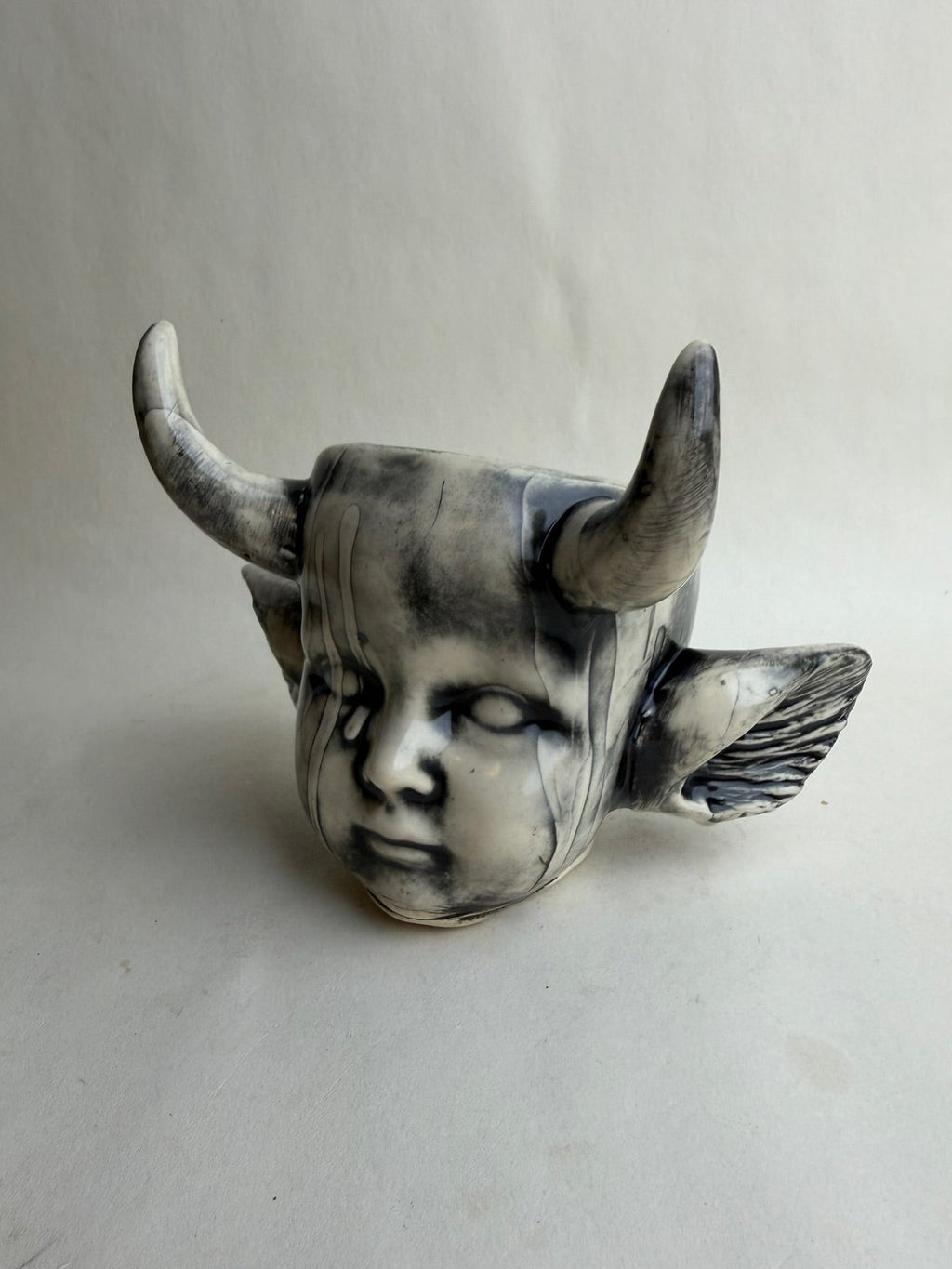 Horned Baby Doll Head With Ears