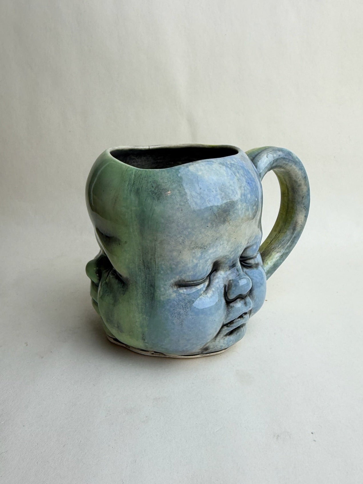 Three Face Baby Doll Head Mug