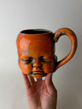 Three Face Baby Doll Head Mug, Warm Colors