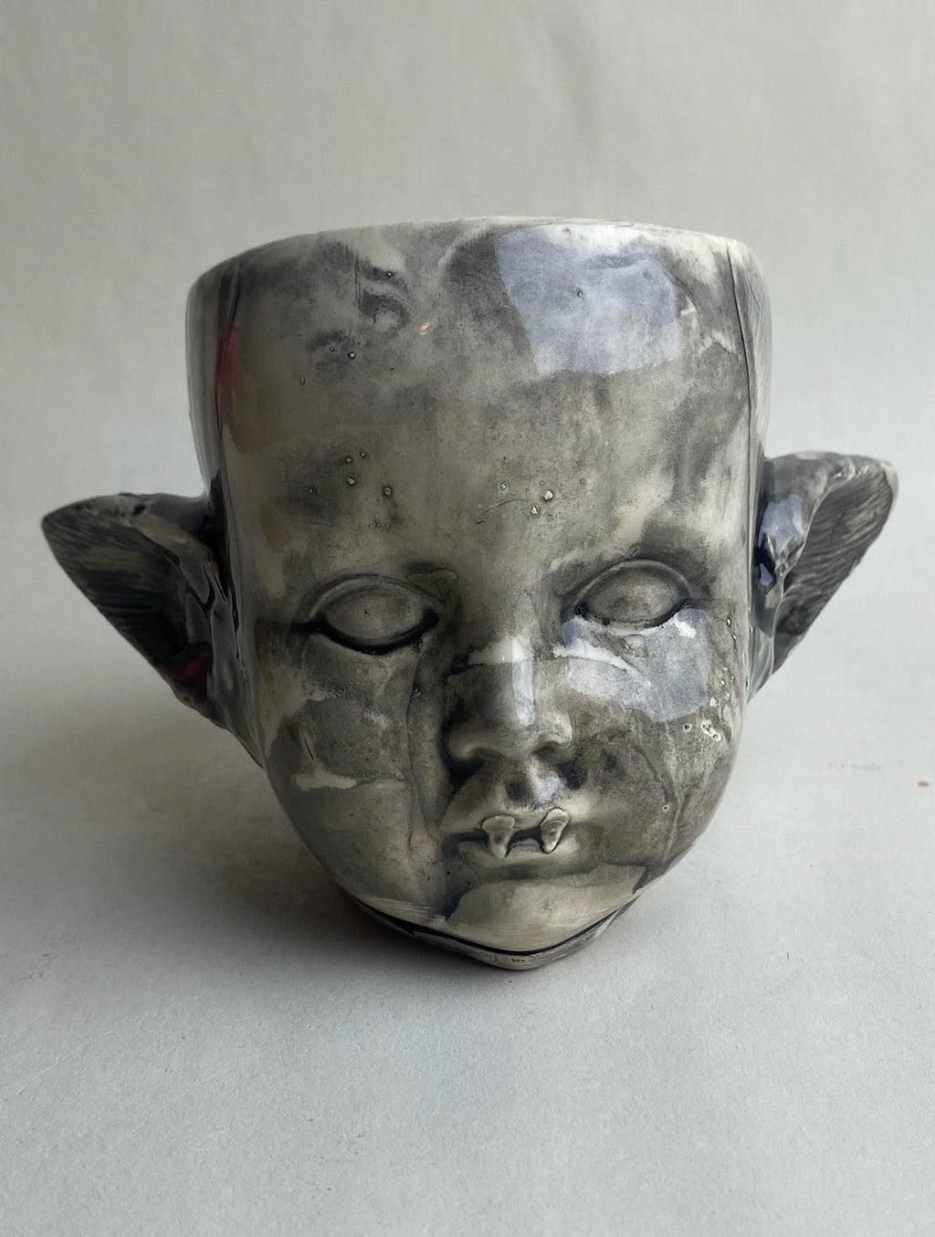 Monster Baby Doll Head With Pointed Ears and Fangs