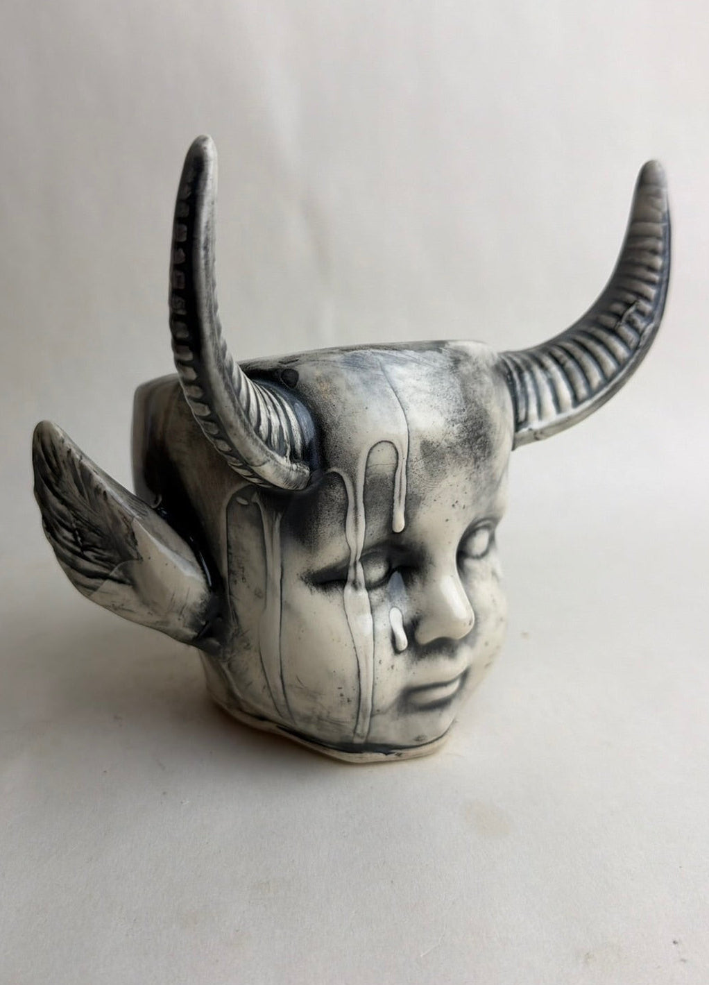 Horned Baby Doll Head With Pointed Ears