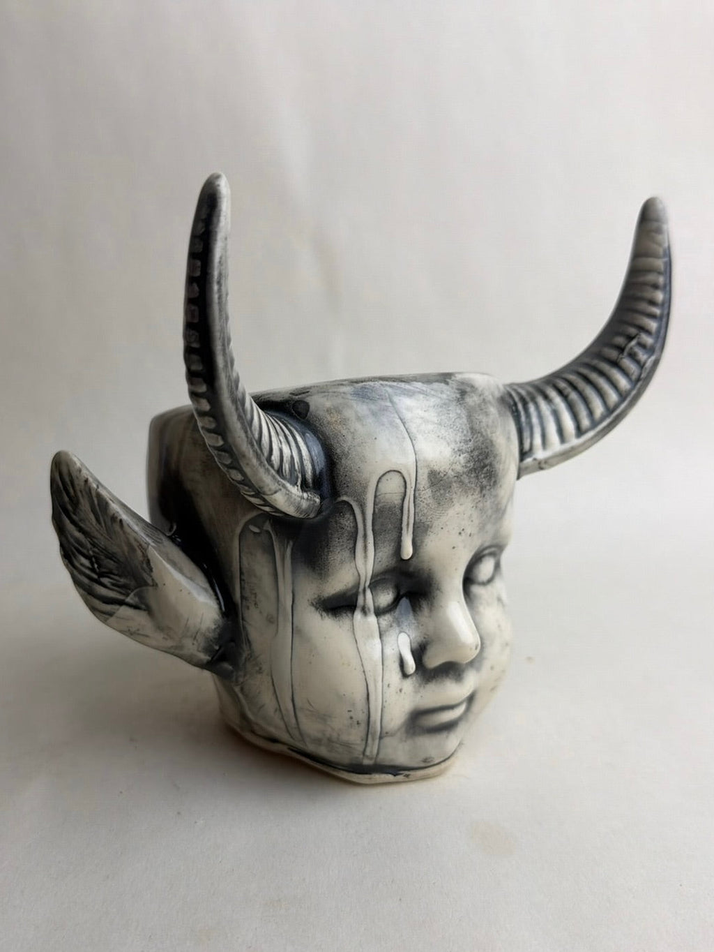 Horned Baby Doll Head With Pointed Ears