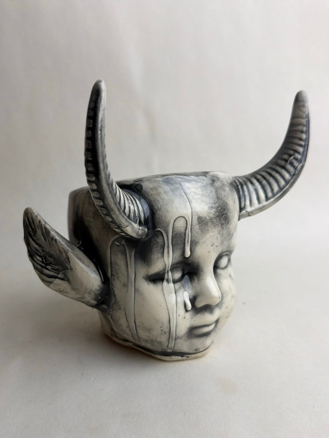 Horned Baby Doll Head With Pointed Ears
