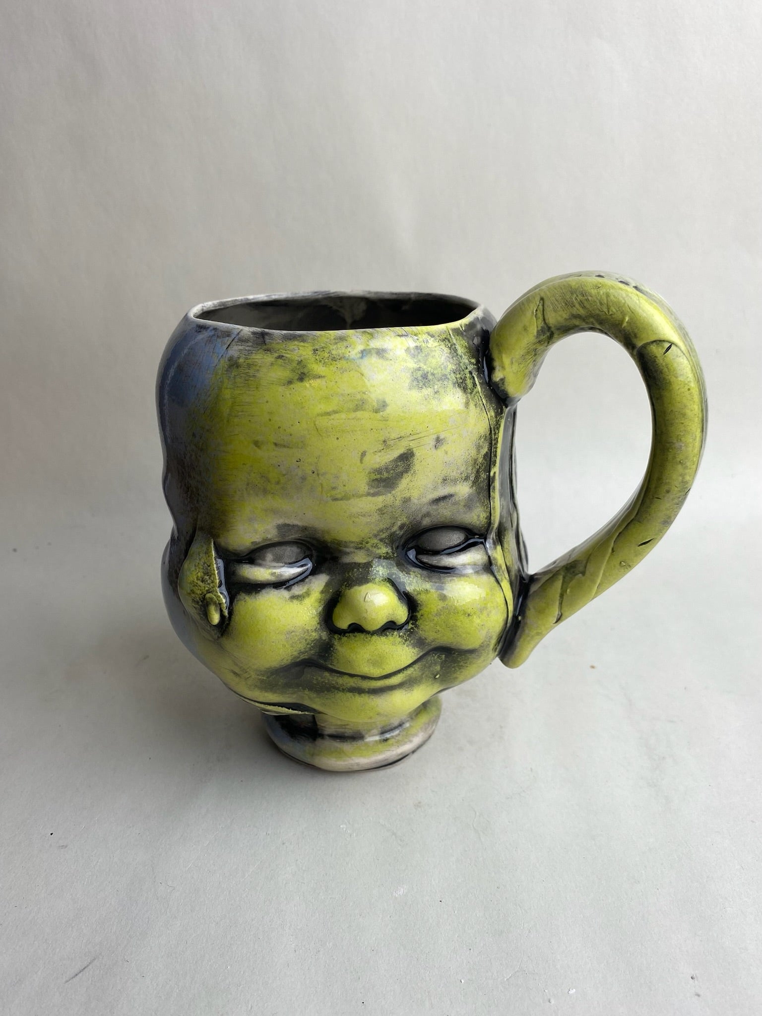 Three Face Baby Doll Head Mug