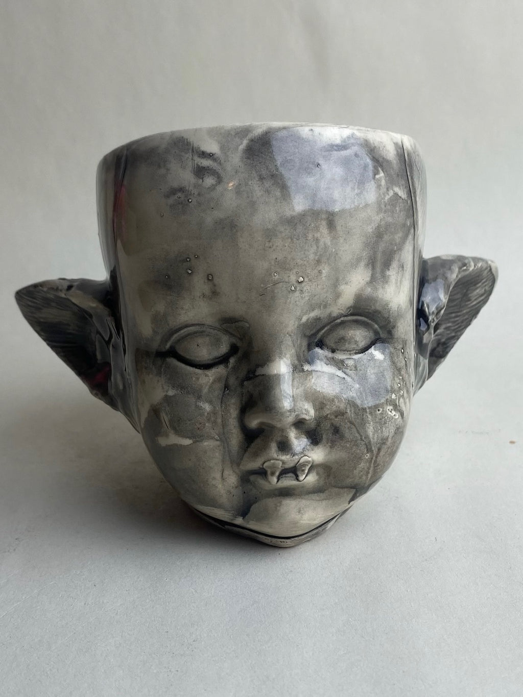 Monster Baby Doll Head With Pointed Ears and Fangs
