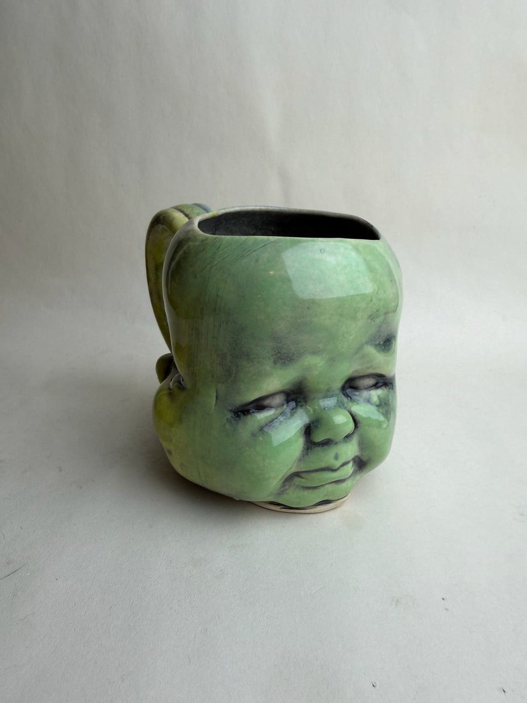 Three Face Baby Doll Head Mug