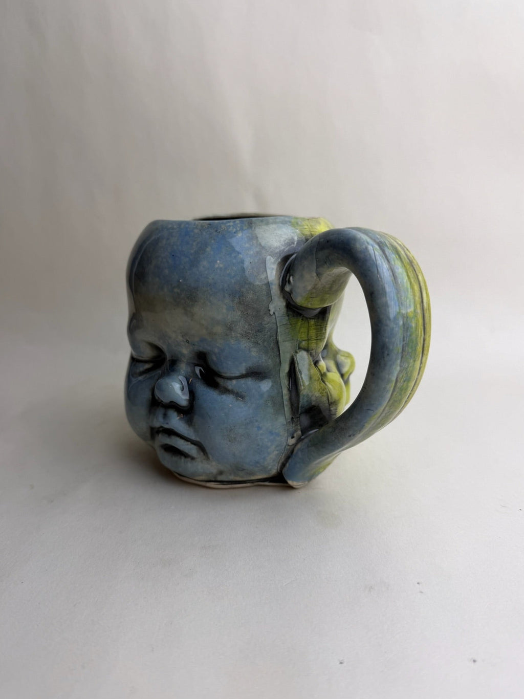 Three Face Baby Doll Head Mug