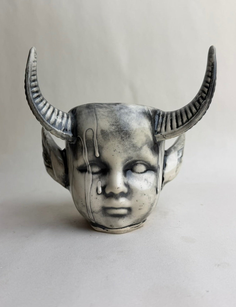 Horned Baby Doll Head With Pointed Ears
