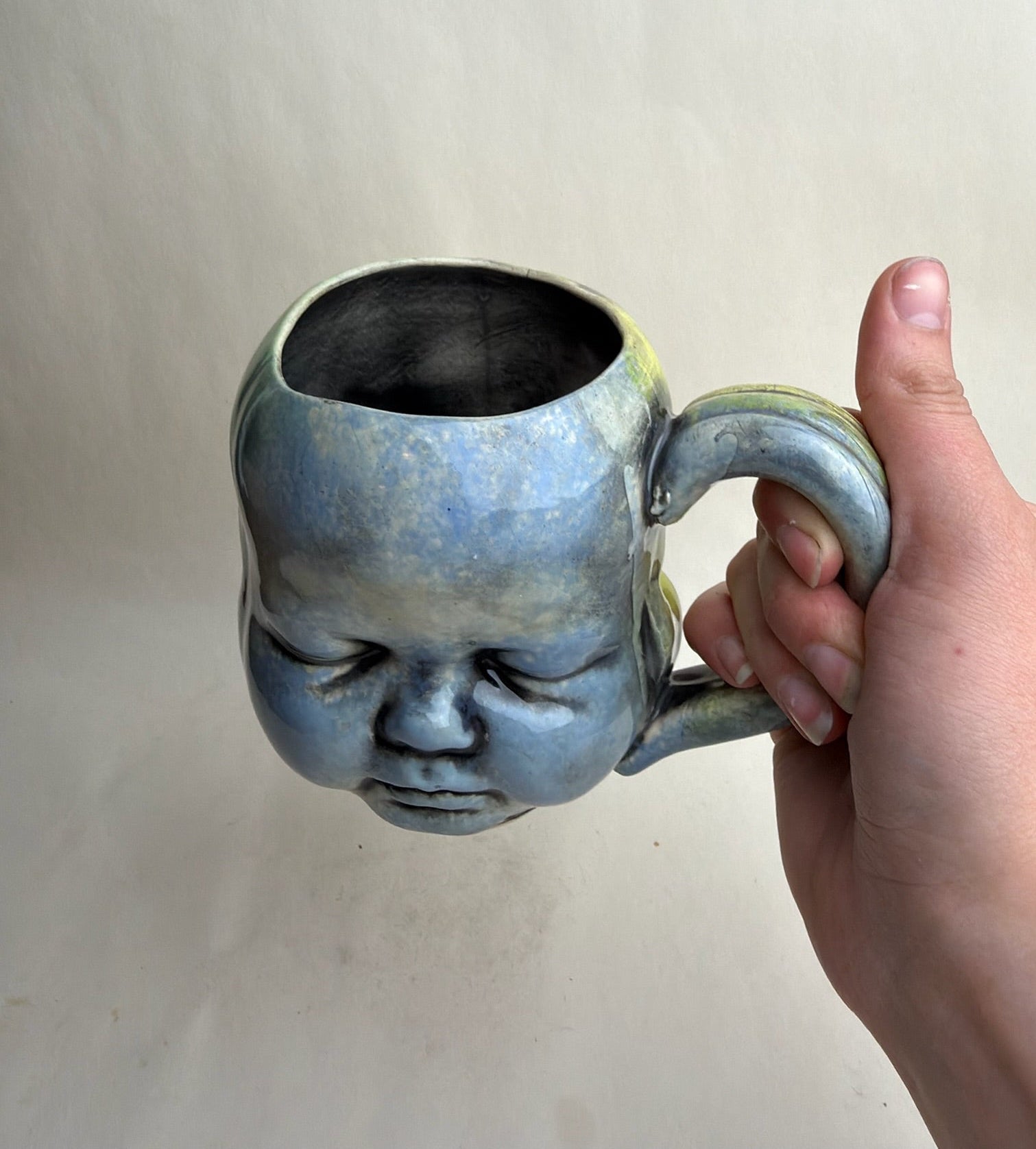 Three Face Baby Doll Head Mug