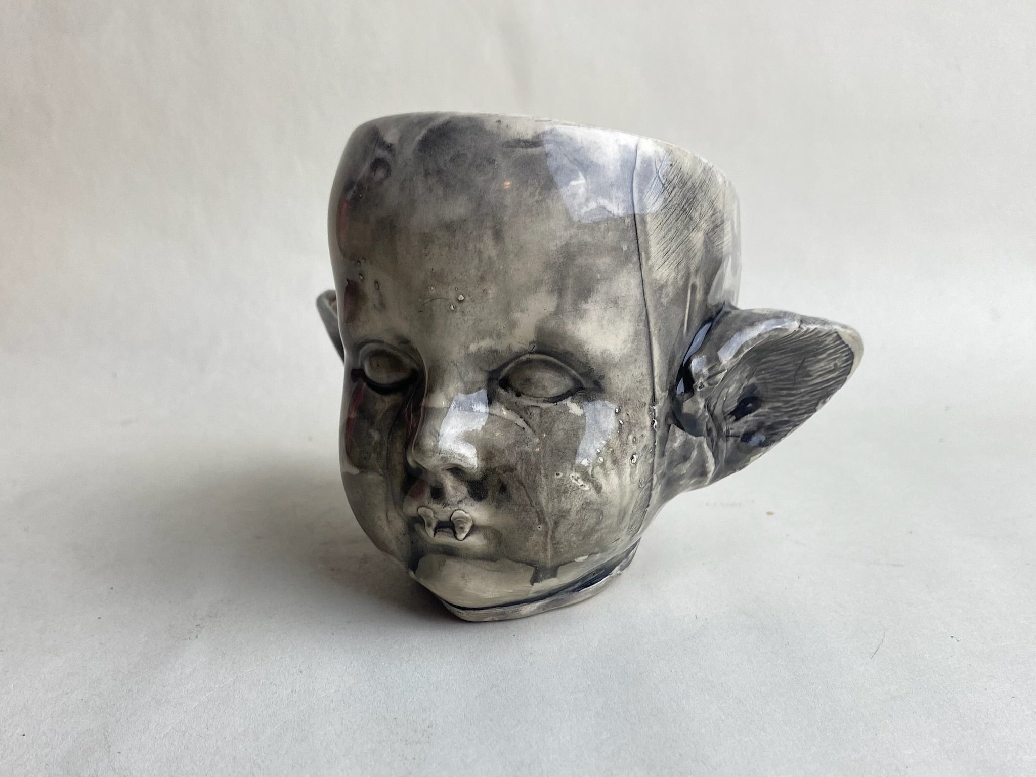 Monster Baby Doll Head With Pointed Ears and Fangs