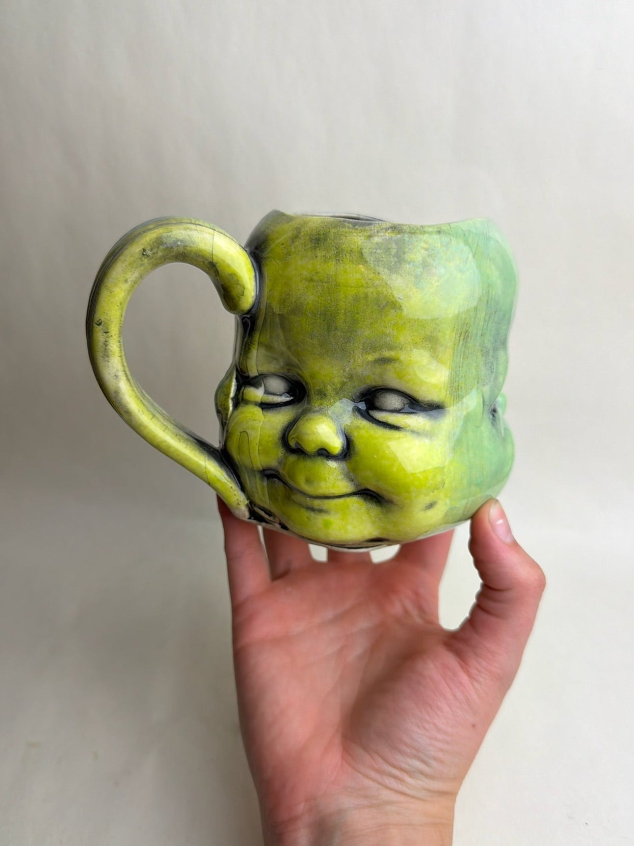 Three Face Baby Doll Head Mug