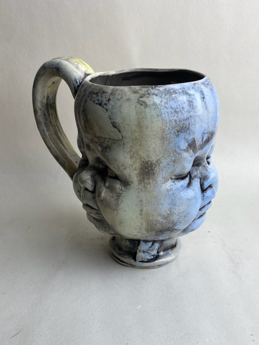 Three Face Baby Doll Head Mug