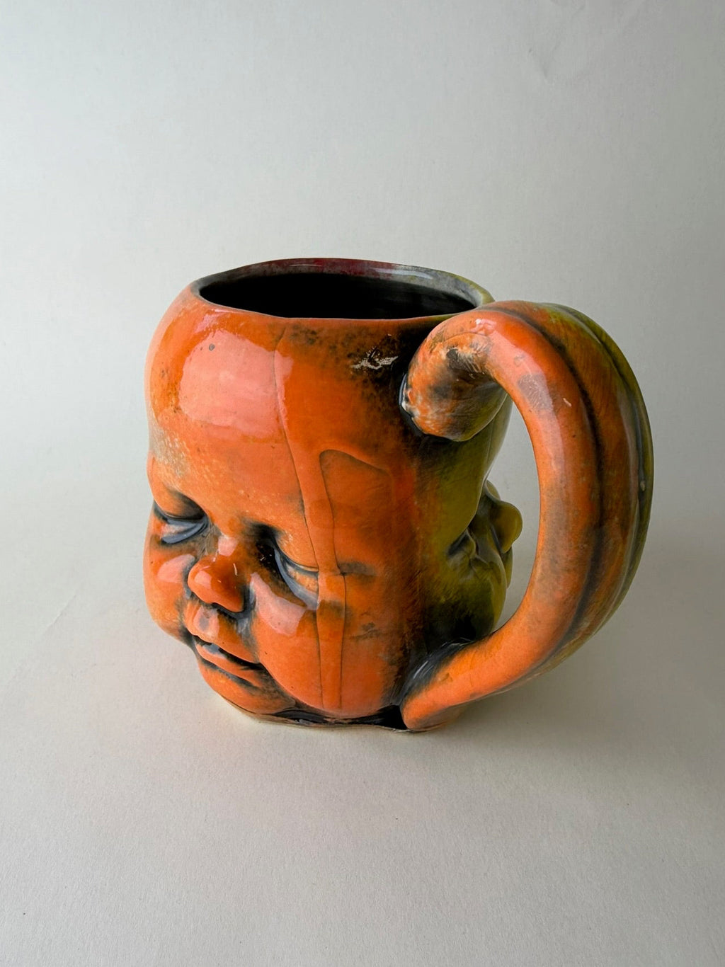 Three Face Baby Doll Head Mug, Warm Colors