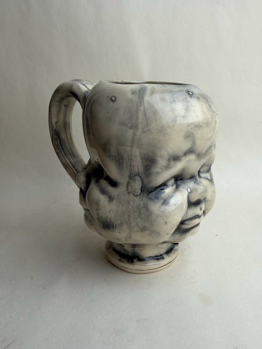 Three Face Baby Doll Head Mug